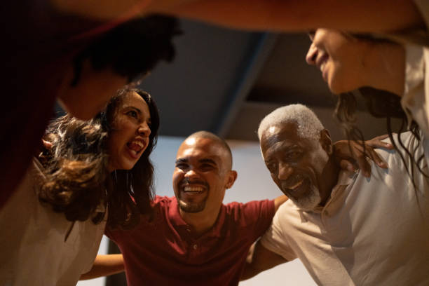 istock Business team embracing 1467884307