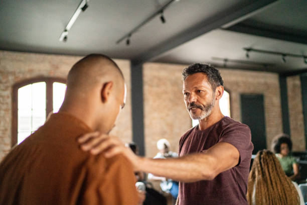 istock Mature man giving support during a psychotherapy 1467884421