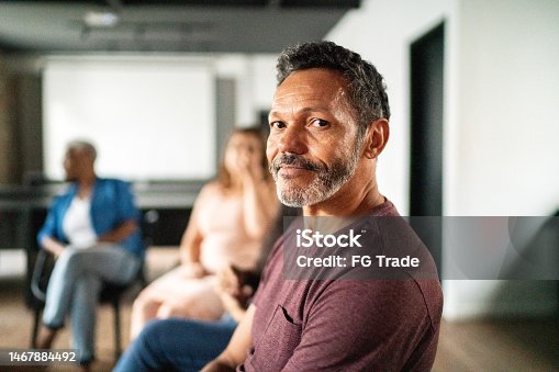 istock Portrait of a mature man at group therapy 1467884492