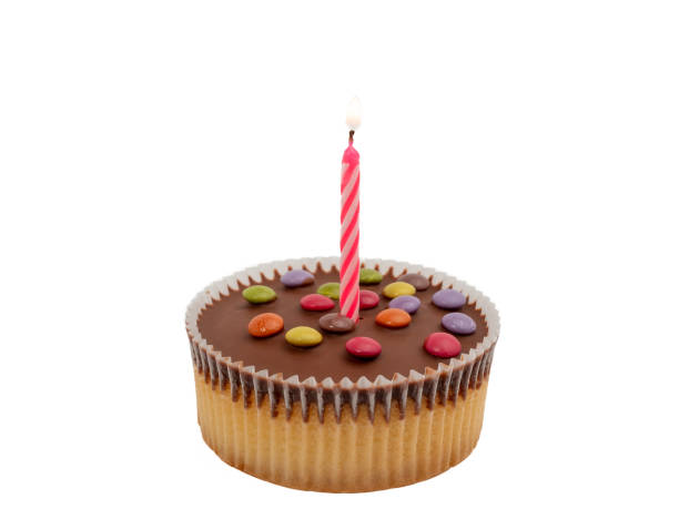istock Muffin with a candle on a white background. Holiday muffin. 1467885465