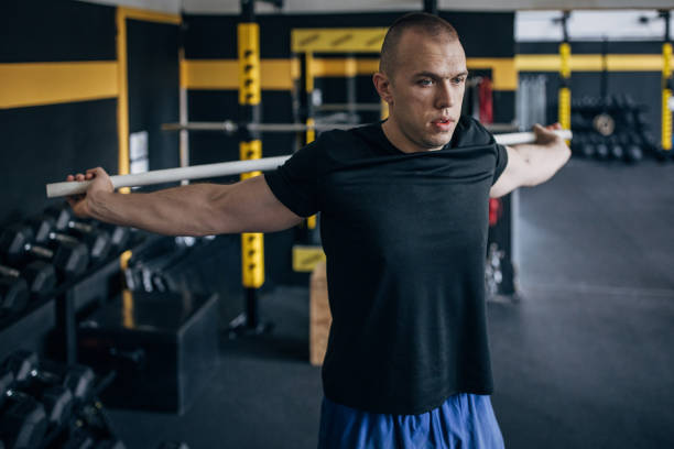 istock Man exercising in gym 1467886835