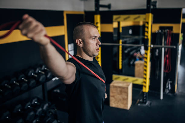 istock Man exercising in gym 1467887006