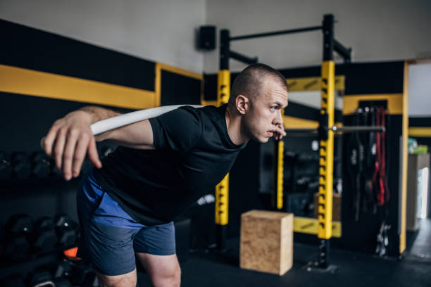 istock Man exercising in gym 1467887033