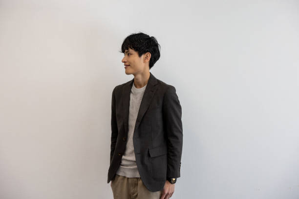 Entrepreneur standing on beige background