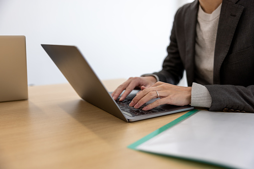 Entrepreneur using laptop in meeting room
