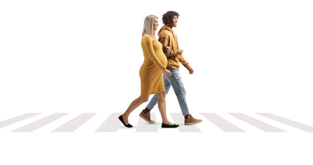 istock Interracial expecting couple walking on a pedestiran crossing 1467887846