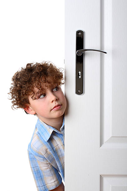 istock Boy peeking behind the door 146788800