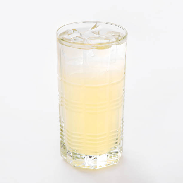 istock One glass of fresh cold lemonade with ice. 1467888253