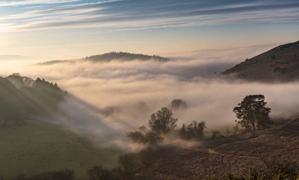 Offa's Dyke is a large linear earthwork that roughly follows the border between England and Wales. The structure is named after Offa, the Anglo-Saxon king of Mercia from AD 757 until 796, who is traditionally believed to have ordered its construction.
