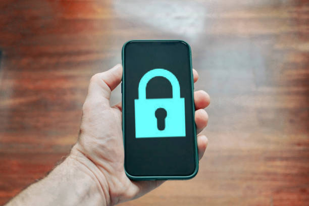 istock hand holding a phone with a padlock security symbol 1467889667
