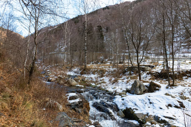 istock Winter Wonderland: Majestic Snowy Landscape with a Serene River 1467890598