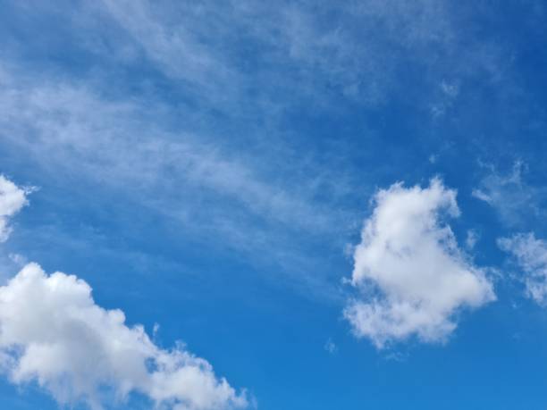 istock close up of white clouds against a bright blue sky background 1467891926