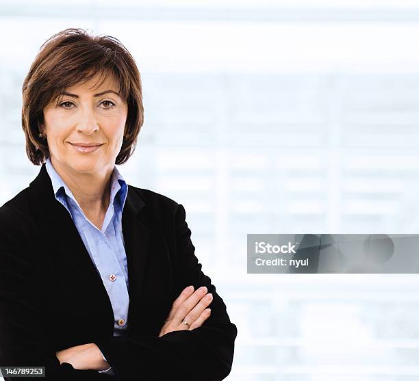 Businesswoman With Crossed Arms Stock Photo - Download Image Now - 50-54 Years, 50-59 Years, Adult