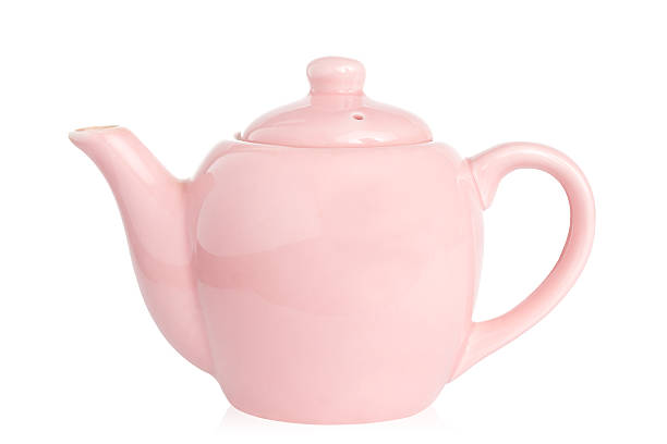 istock Cute pink teapot isolated against white with clipping path 146789353
