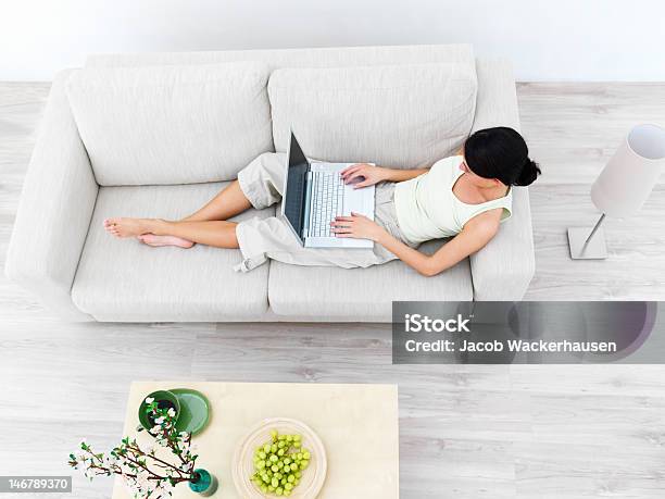 High Angle View Of A Businesswoman Using Laptop On Sofa Stock Photo - Download Image Now