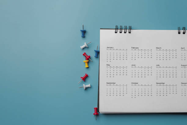 istock Embroidered red pins on a calendar event Planner calendar,clock to set timetable organize schedule,planning for business meeting or travel planning concept. 1467893732