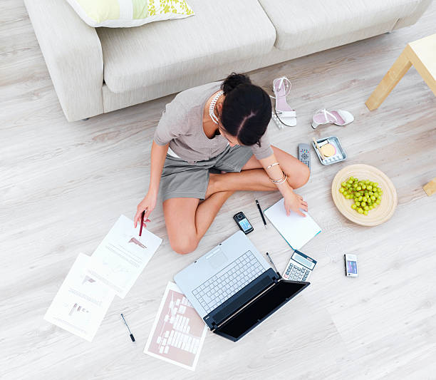 istock Businesswoman using laptop in house 146789420