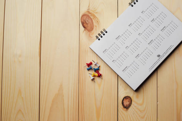 istock Embroidered red pins on a calendar event Planner calendar,clock to set timetable organize schedule,planning for business meeting or travel planning concept. 1467894353