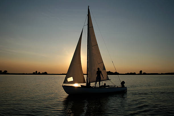 istock silhouette of sailing boat in the setting sun 146789452