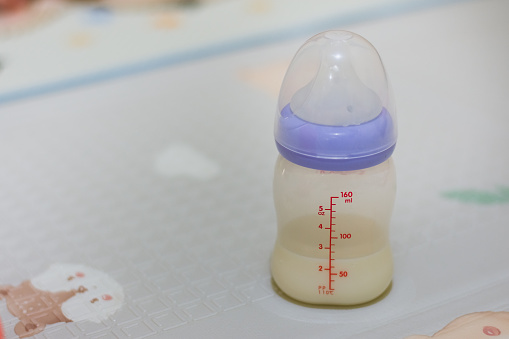 Baby bottle on baby carpet