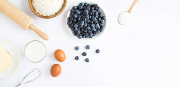 istock Top view of ingredients for making blueberry pie or cake on the white background. Copy space. 1467898016
