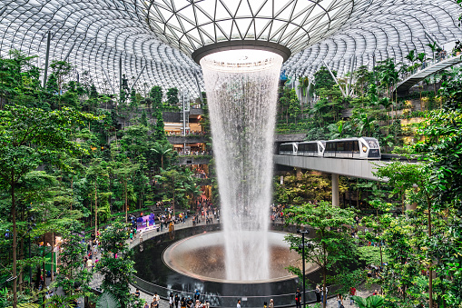 Singapore: 12 February 2023 -Rain Vortex, a 40m-tall indoor waterfall located inside Jewel Changi Airport, Singapore