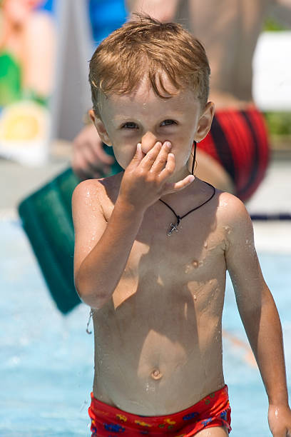istock boy goes on water and behaves for a nose 146790047