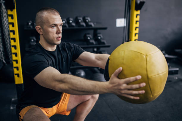 istock Man training with medicine ball 1467901019