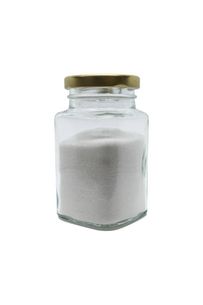 istock Salt in a glass jar with closed lid. Isolated on white with clipping path. 1467902435