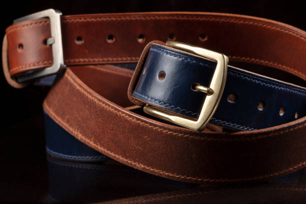 istock Leather belts on a black background. Haberdashery. 1467903123