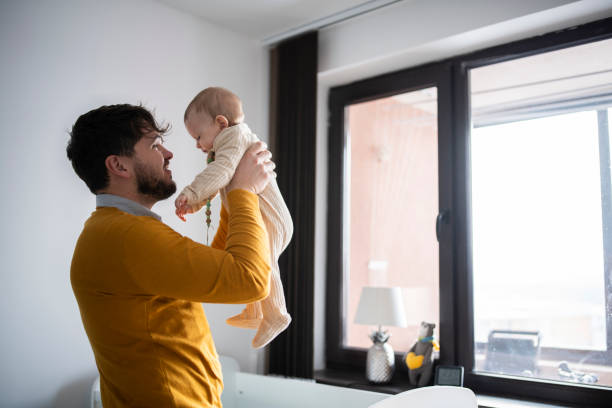 istock Happy moment between father and baby son. 1467904307