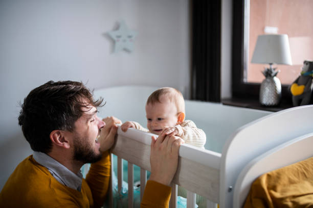 istock Mid adult father being playful with his infant son. 1467904330