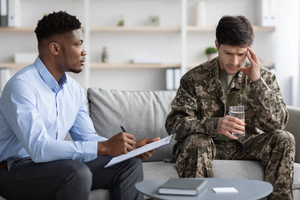 istock African american psychotherapist having session with soldier 1467904470