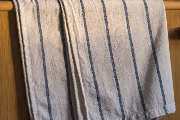 istock Kitchen towel hanging from the wooden door, close up. 1467904821