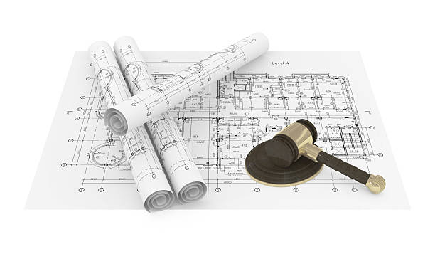 istock Rolled Blueprints and gavel of justice 146790500