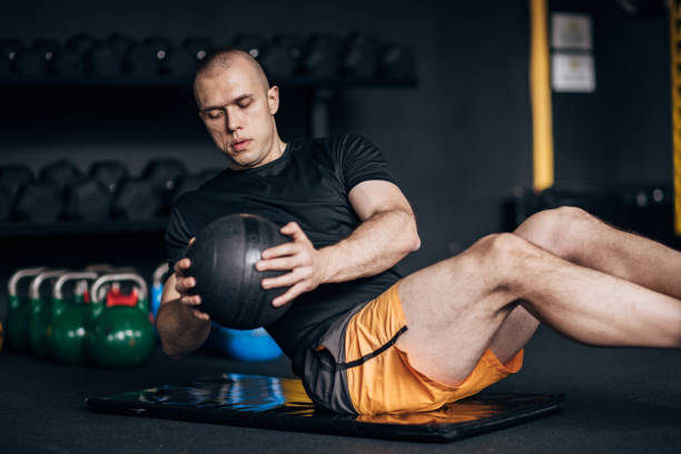 istock Man training with medicine ball 1467905987