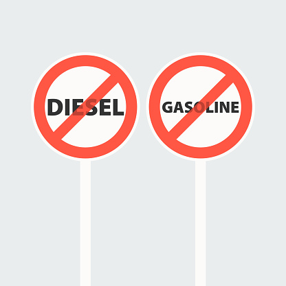 Road sign prohibiting gasoline and diesel vehicles. Red crossed out circle.