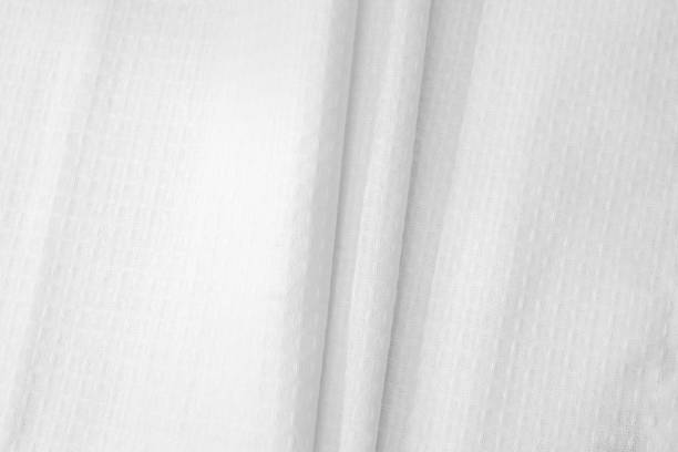 istock White textured cotton fabrics swatches on light background. Layered Textile Mockup 1467907870