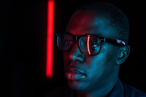 Portrait of Afro-American man in darkness