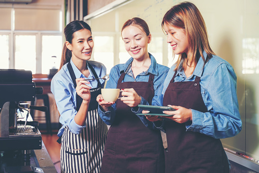 Group woman people leaning and education workshop for classes barista coffee in cafe room.  Preparing teacher meeting and training service about hospitality and make coffee.  Education Concept