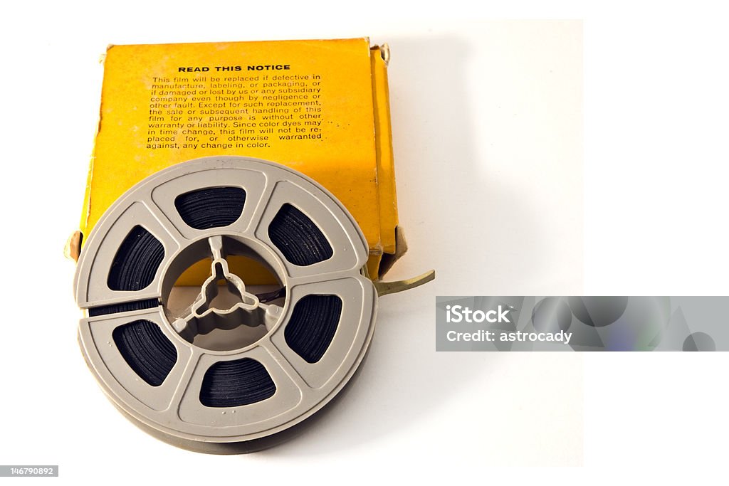 8mm Movie Film 8mm movie film on plastic real, with yellow box.  Isolated on white backgroud. Box - Container Stock Photo