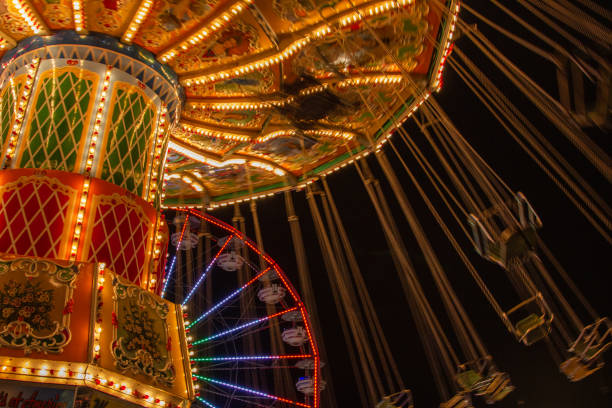 istock Large and victorian decorated carnival ride with swings 1467910723