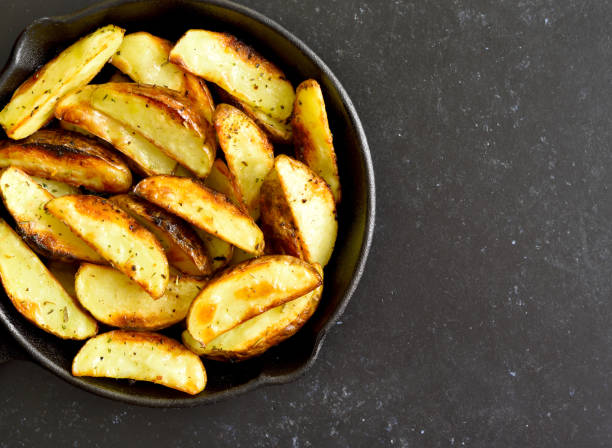 istock Potato wedges in frying pan 1467911811