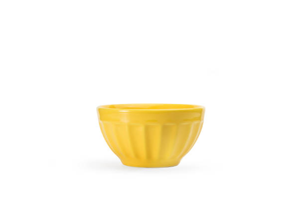 istock Yellow ceramic bowl on a white background with copy space 1467911917