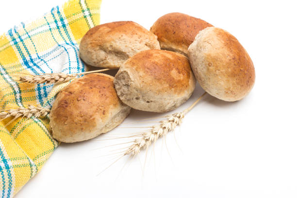 Delicious fresh baked knot bread roll with sesame seeds