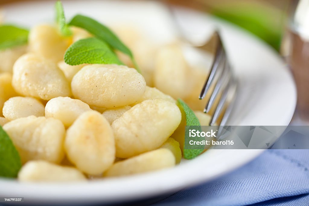 Close up of a serving of gnocchi with fresh sage and a fork close-up of gnocchi with fresh sage Close-up Stock Photo