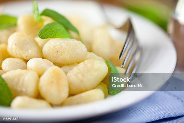 Close Up Of A Serving Of Gnocchi With Fresh Sage And A Fork Stock Photo - Download Image Now