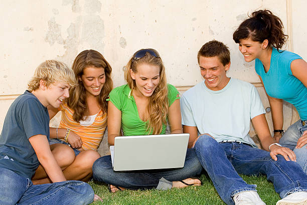 istock group of teens with laptop 146791464