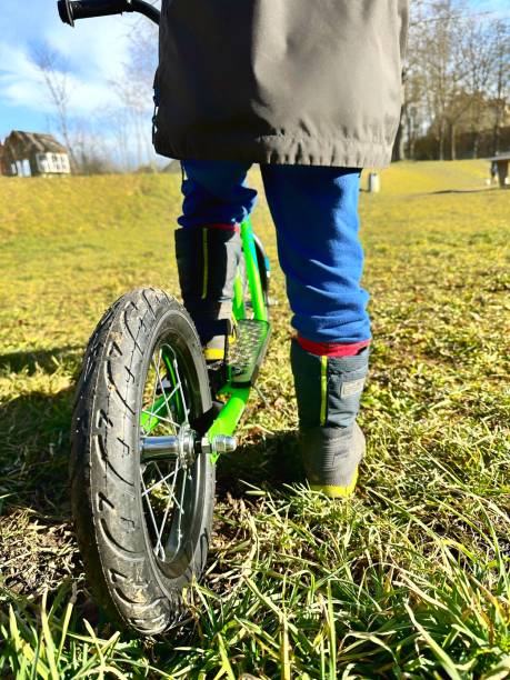 istock A little kid plays with his scooter at the park 1467915966