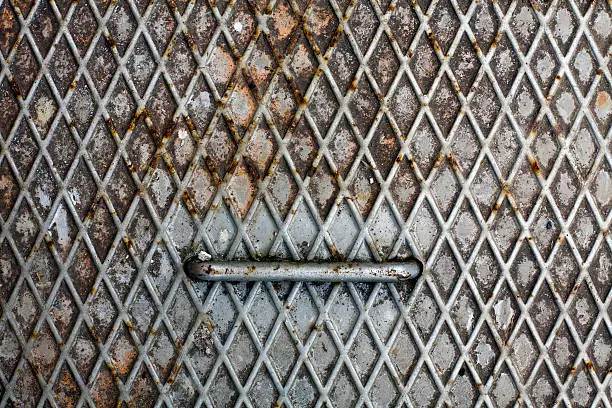 rusty cover with rhombus pattern